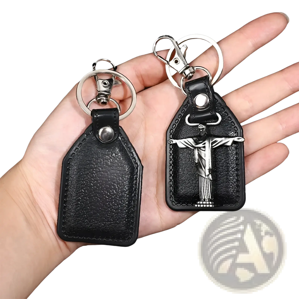 Black leather saint christopher keychain with silver toned metal jesus christ pendant and antique bronze details