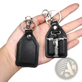Black leather saint christopher keychain with silver toned metal jesus christ pendant and antique bronze details