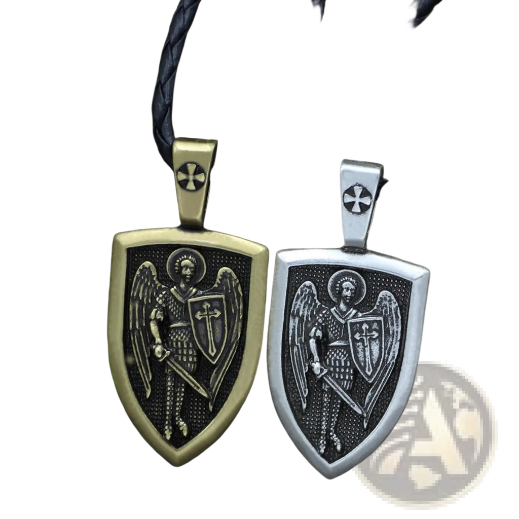 Two shield-shaped pendants in antique gold and silver featuring engraved Saint Michael Archangel on braided cord necklaces