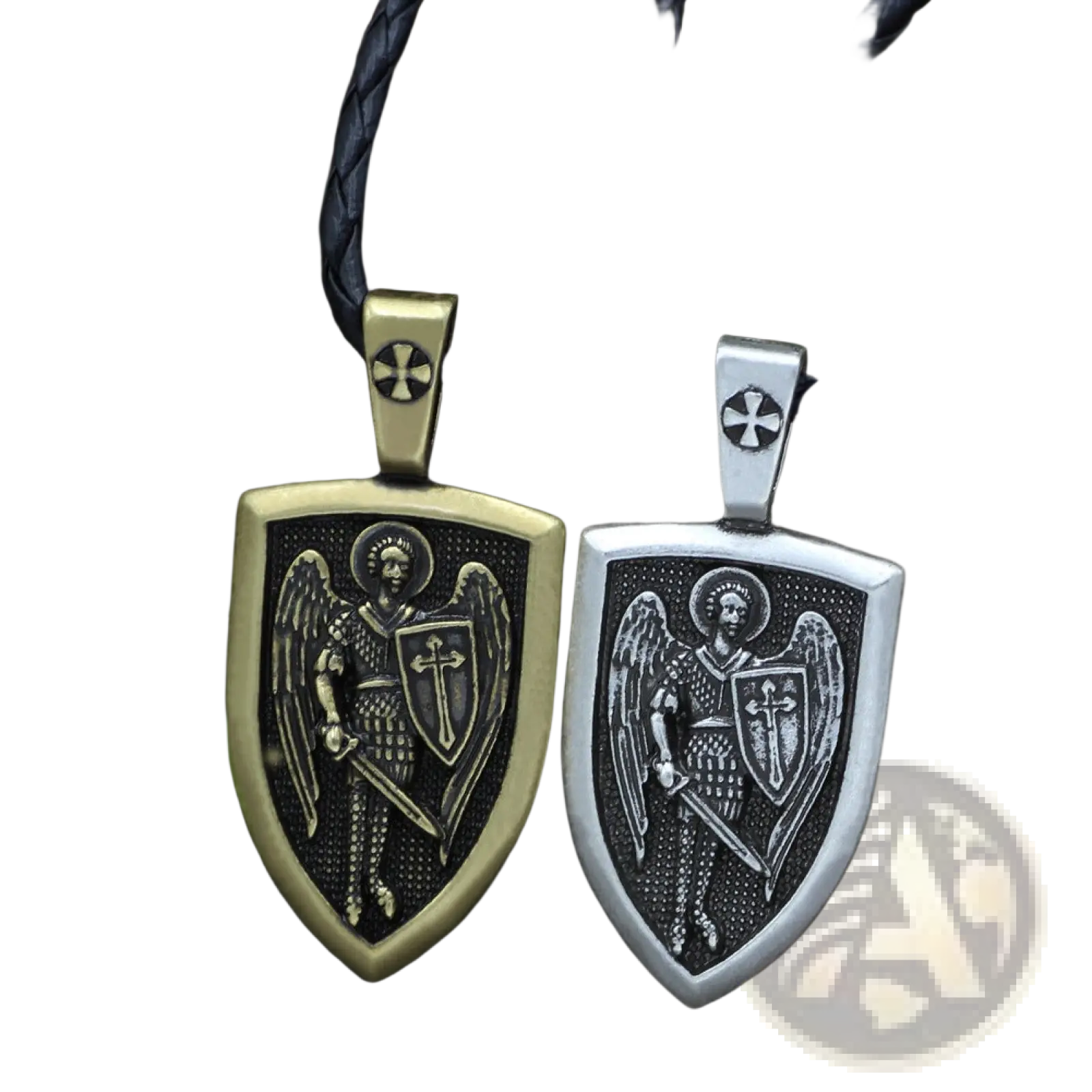 Two shield-shaped pendants in antique gold and silver featuring engraved Saint Michael Archangel on braided cord necklaces