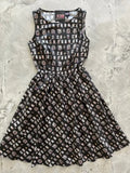 Salem School vintage witch print black cotton sleeveless dress with flared skirt and white gray tombstone pattern