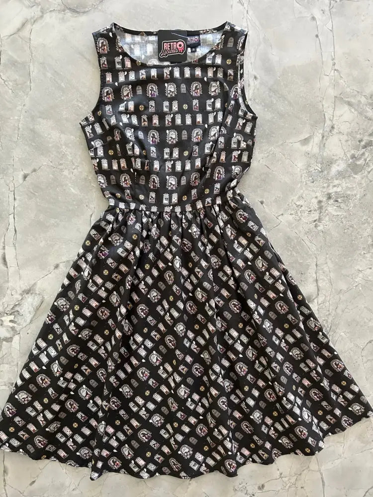 Salem School vintage witch print black cotton sleeveless dress with flared skirt and white gray tombstone pattern
