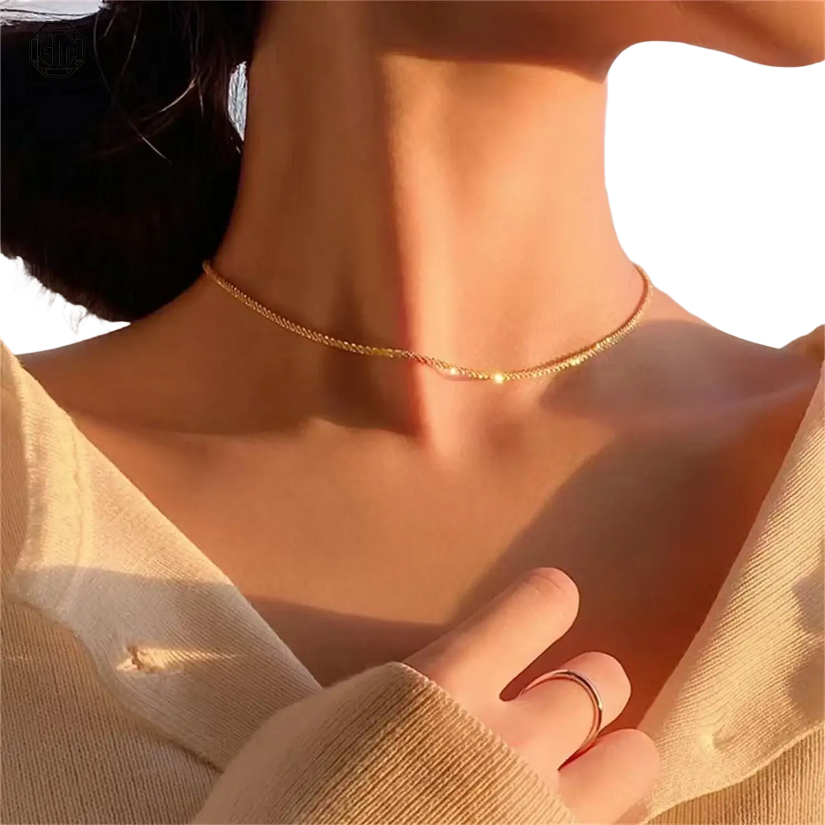 A delicate gold-toned chain choker necklace with small beads paired with a fade resistant sand gold adjustable ring matte wide band unisex