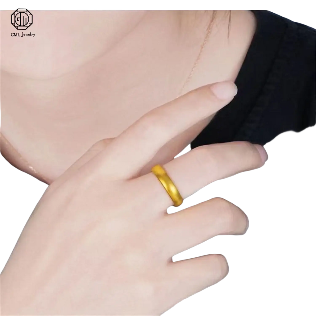 A fade resistant sand gold adjustable ring featuring a matte wide band with a smooth, slightly textured surface