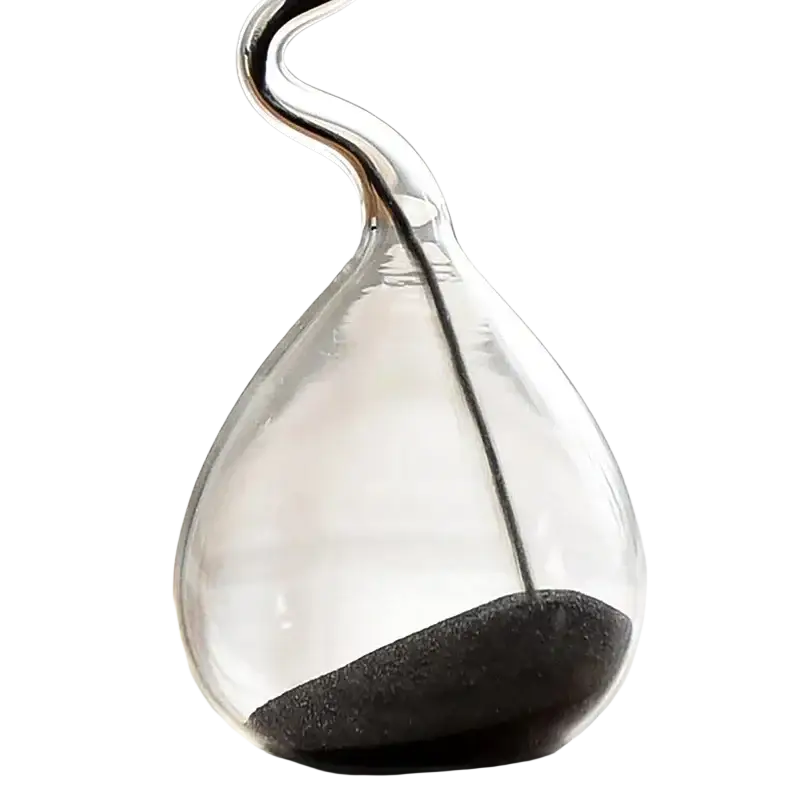 A sleek transparent glass sand timer hourglass with a curved neck and dark sand for home decoration