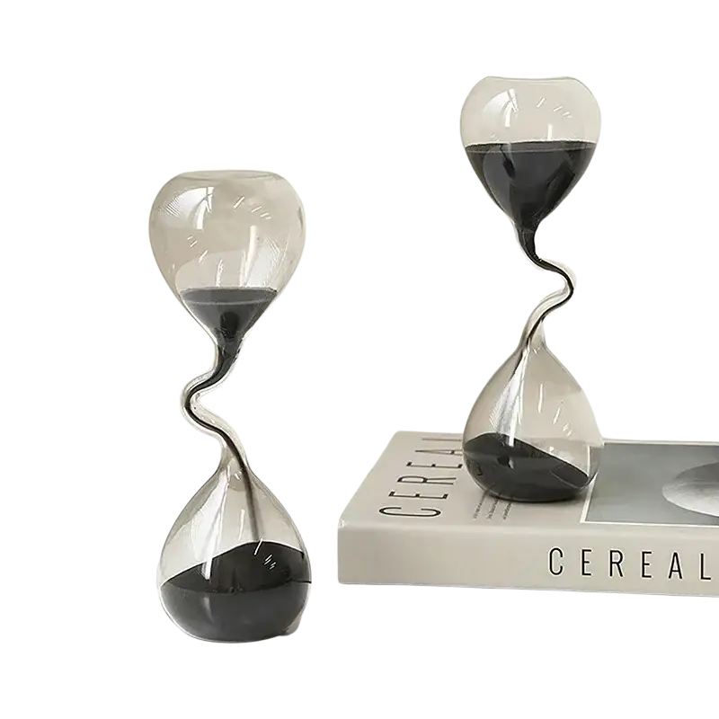 Two transparent glass hourglass timers with black sand and twisted neck design for elegant home decoration