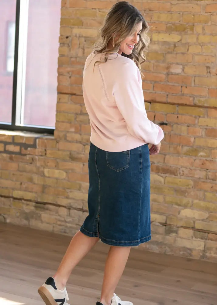 Sandra dark wash denim midi pencil skirt in dark wash with visible stitching and a straight mid-thigh length cut