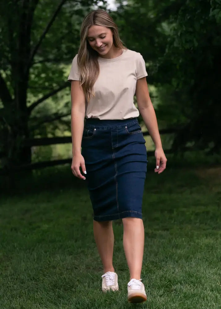 Sandra dark wash denim midi pencil skirt in dark blue showcasing classic denim fabric and sleek fit design