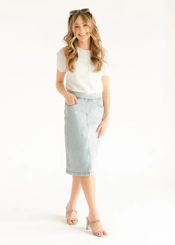Sandra light wash denim stretch midi skirt with a classic straight-leg cut and rolled hem in light wash denim