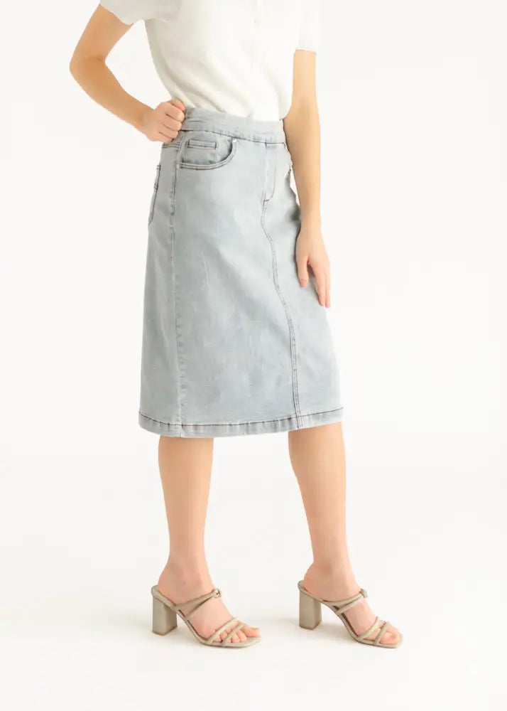 Sandra light wash denim stretch midi skirt with classic a-line cut and front pocket detail in light-wash denim