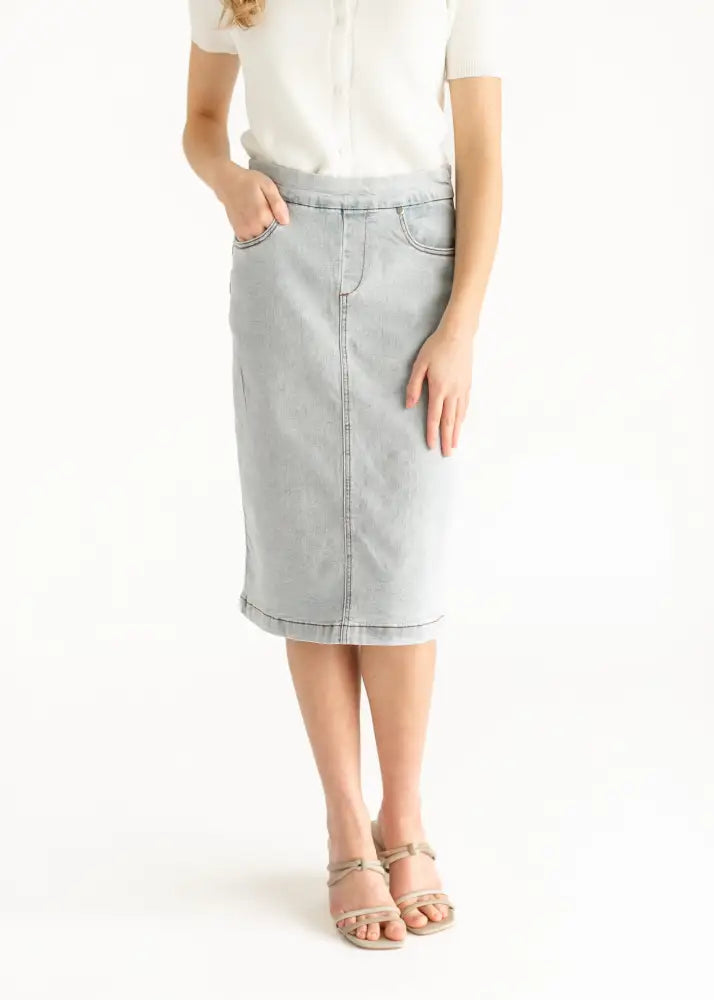 Sandra light wash denim stretch midi skirt in light gray with button zipper closure two front pockets and rolled hem