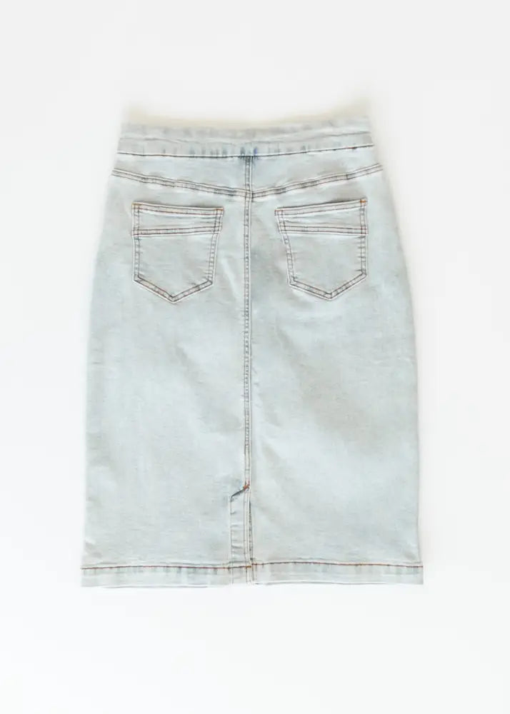 Sandra light wash denim stretch midi skirt back side showing fitted silhouette two back pockets and visible stitching details