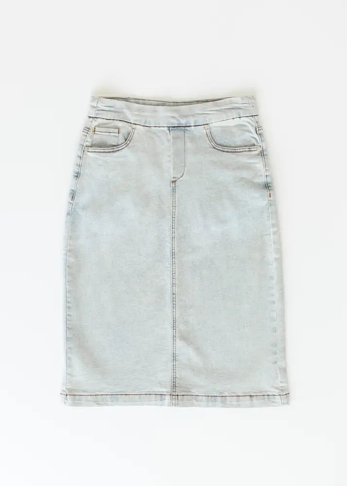 Sandra light wash denim stretch midi skirt featuring a classic waistband and front pockets in light-wash denim