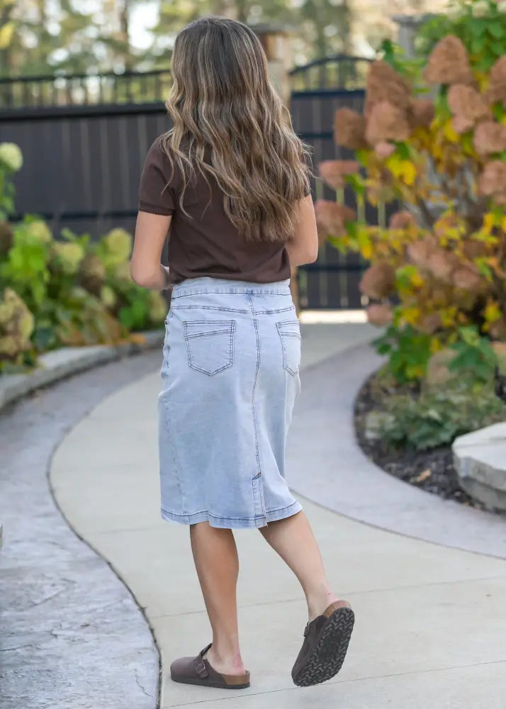Sandra light wash denim stretch midi skirt with classic five-pocket design and straight-cut hem in light wash denim