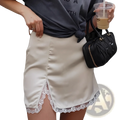 Cream-colored satin a-line mini skirt with delicate white lace trim along the hem for elegant wear