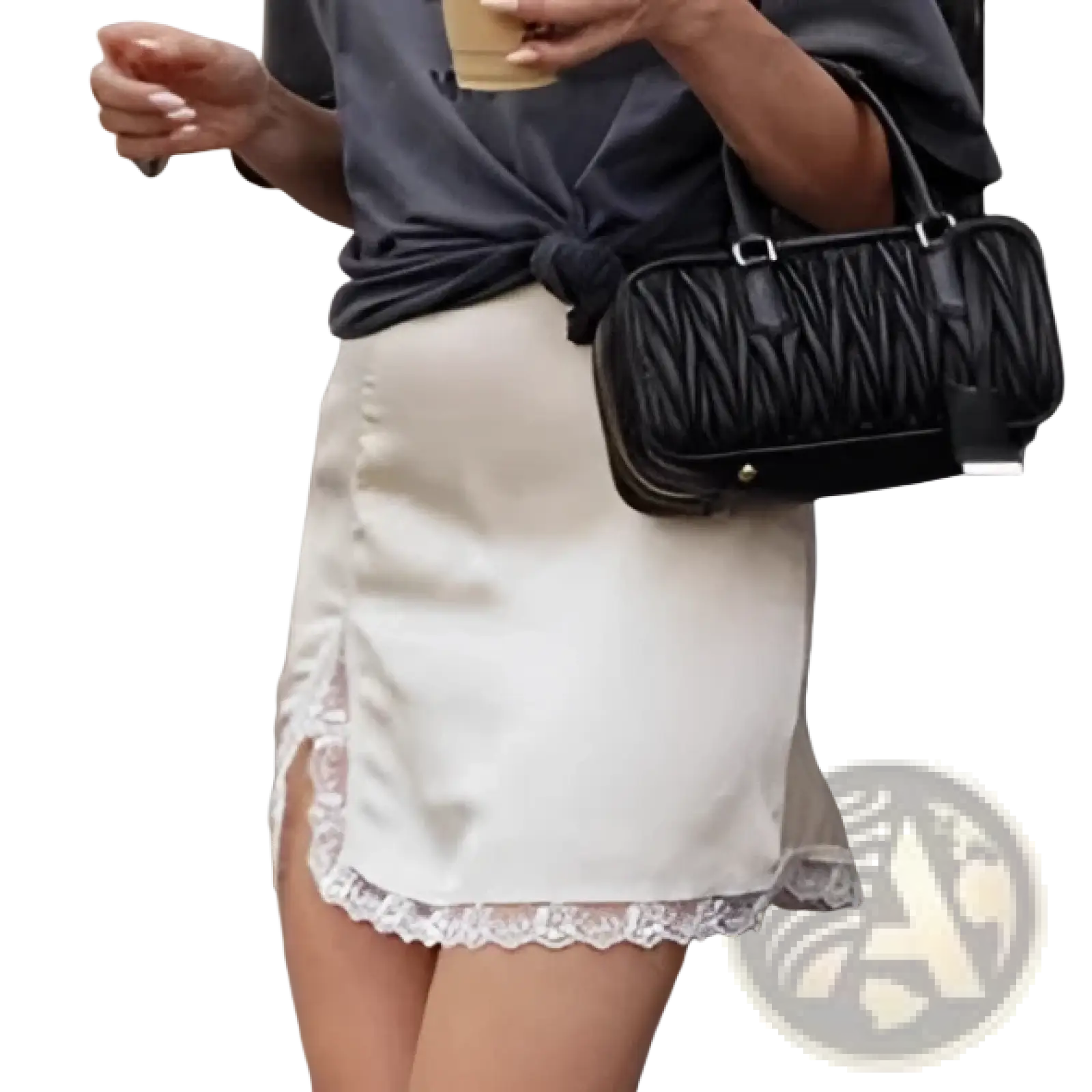 Black quilted handbag with structured rectangular shape and silver-tone hardware paired with satin lace a-line mini skirt