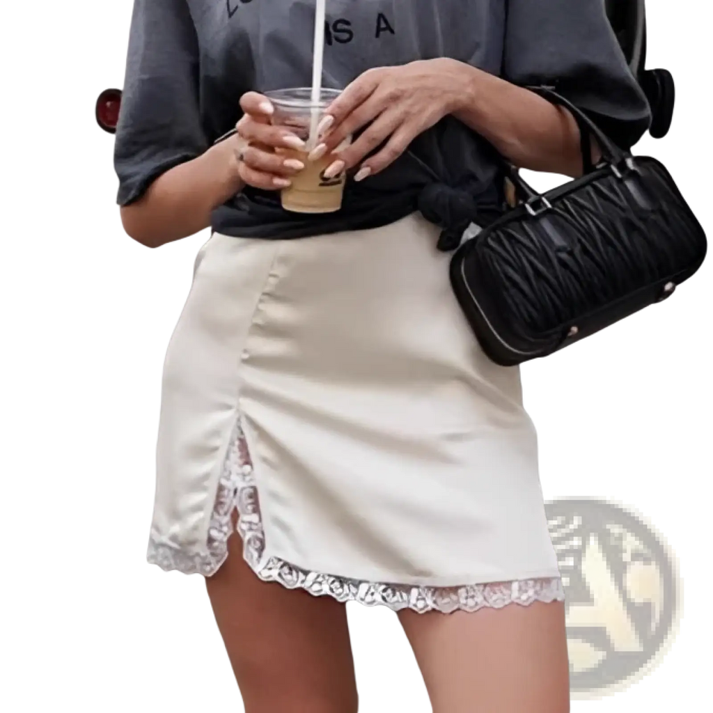 A black quilted handbag with a structured rectangular shape and top handle paired with a satin lace a-line mini skirt