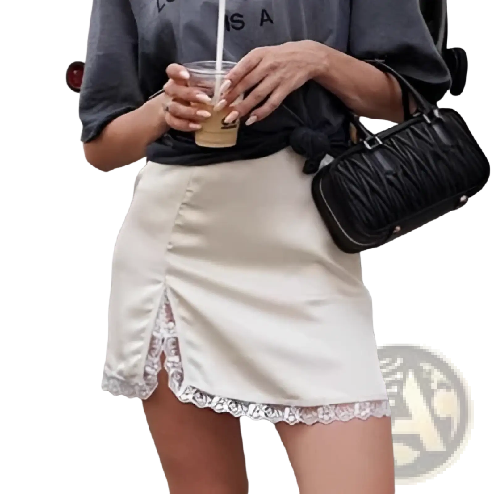 A black quilted handbag with a structured rectangular shape and top handle paired with a satin lace a-line mini skirt