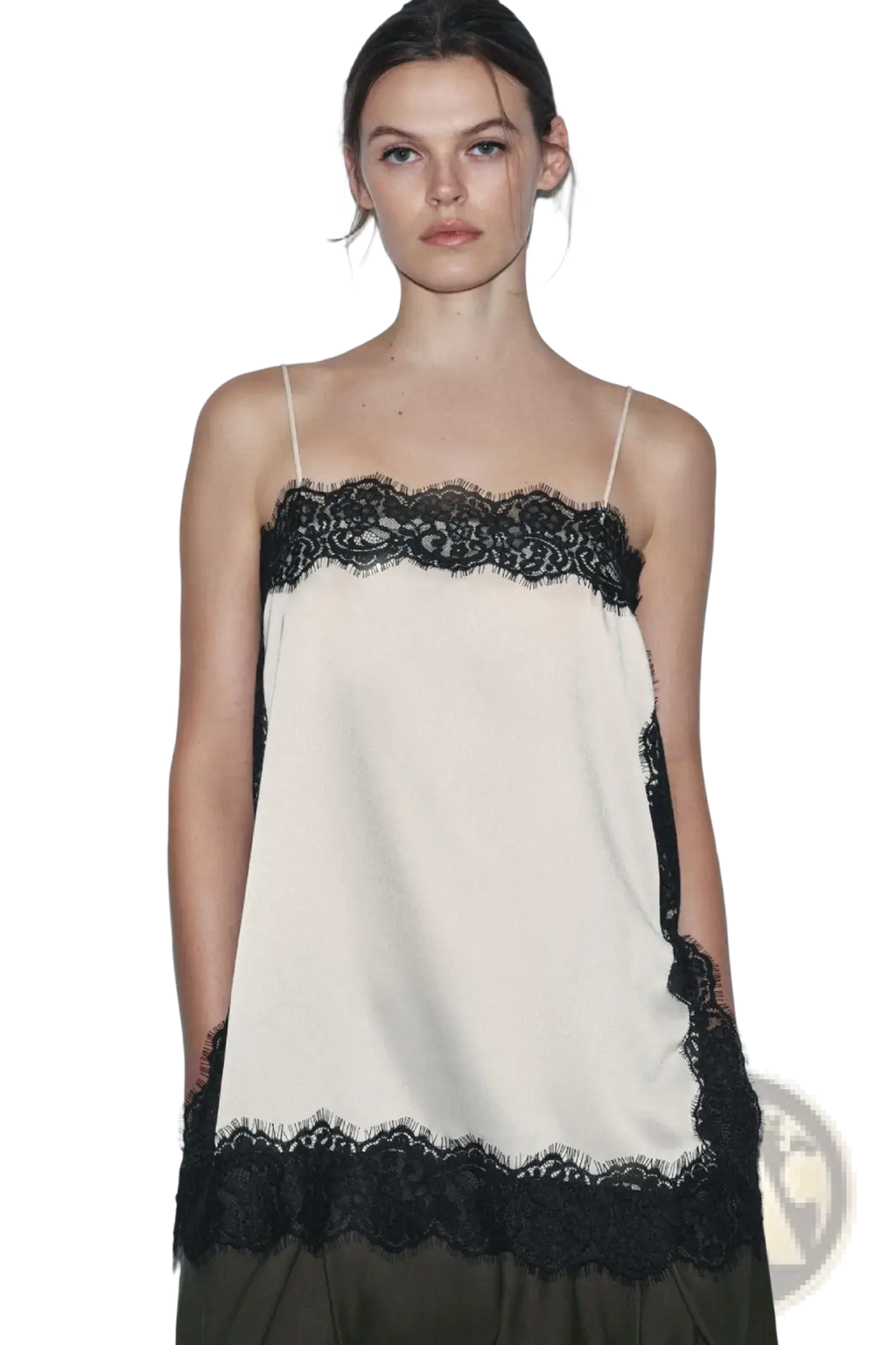 Cream-colored satin camisole top with black lace trim along the neckline and hem for elegant wear