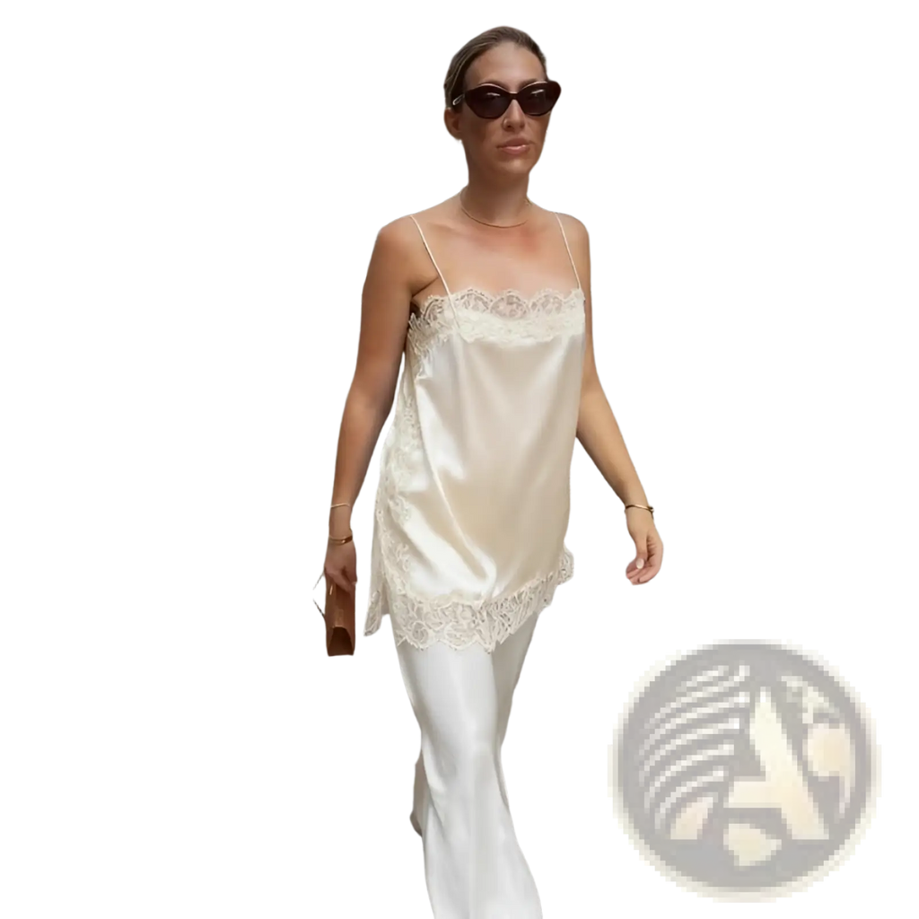 Cream satin camisole top with delicate lace trim showcasing luxurious fabric and elegant design