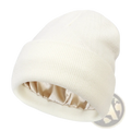 Cream-colored knit beanie with satin-lined interior designed for warmth as a winter hat