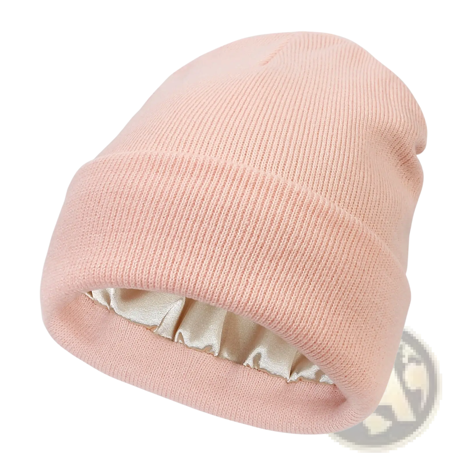 A soft pink ribbed knit beanie with satin lining designed as a warm winter hat