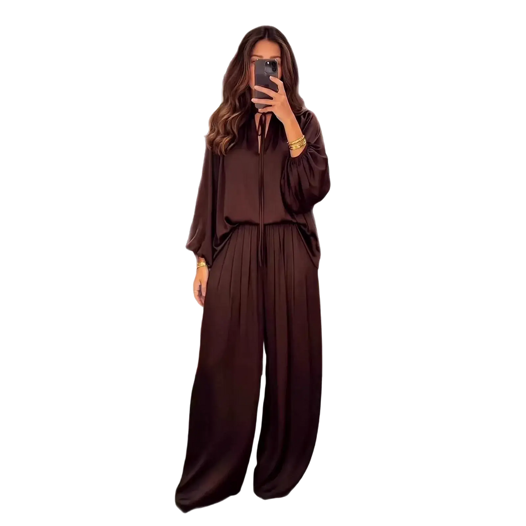 A flowing dark brown satin jumpsuit with wide-leg pants and loose-fitting top for spring summer wear