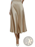 A flowing satin midi skirt in soft beige with a glossy finish and high waistline for elegant commuter apparel