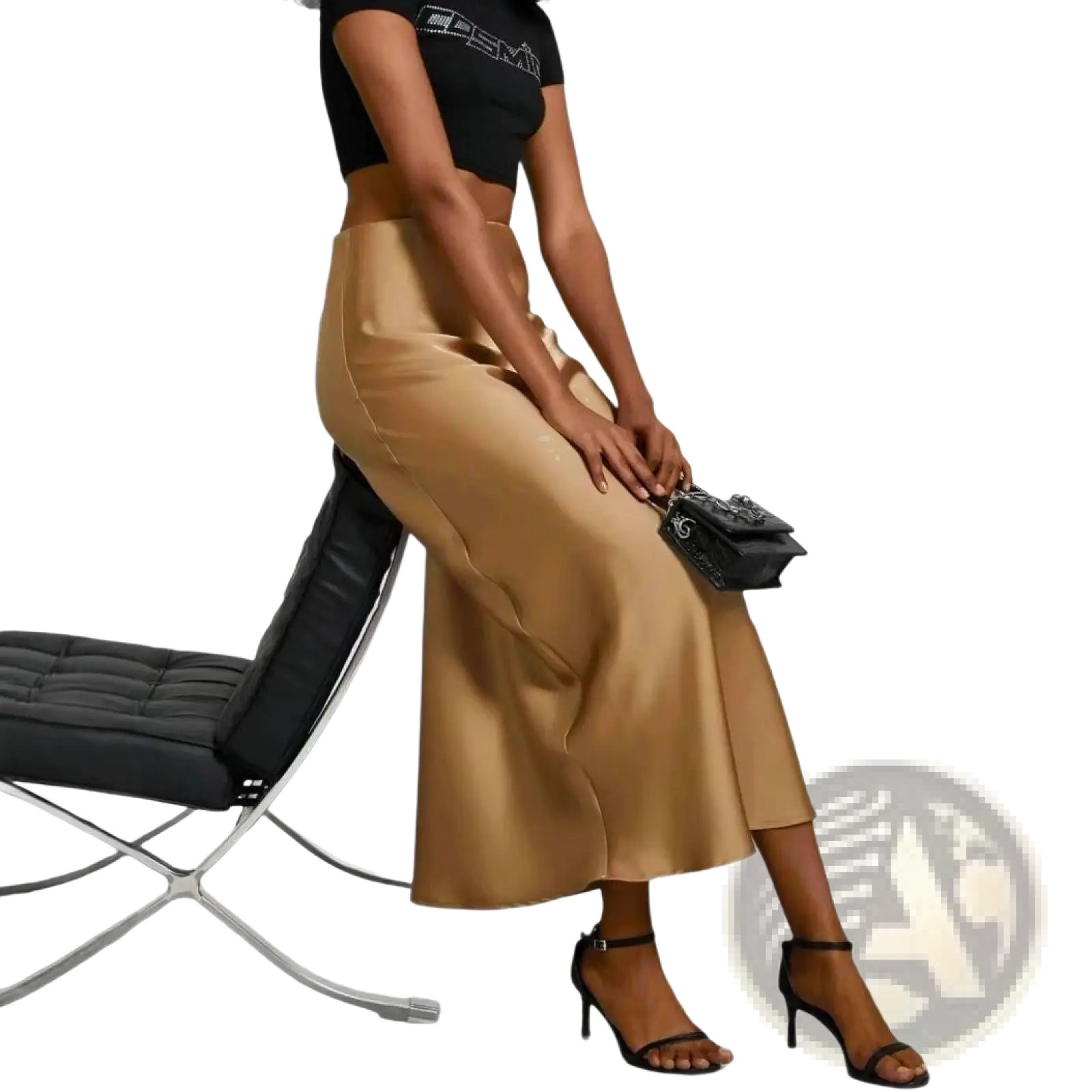A sleek high-waisted gold satin midi skirt with a flowing drape in rose gold silk material