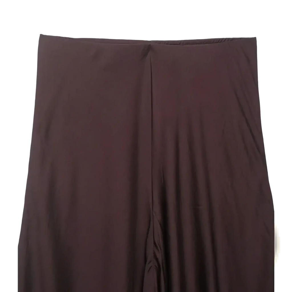 A sleek dark brown satin pleated midi skirt with high waist and smooth flowing drape in an a-line silhouette