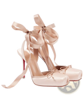Beige satin high-heeled ballet flats with ribbon ties and red leather sole visible from the back side