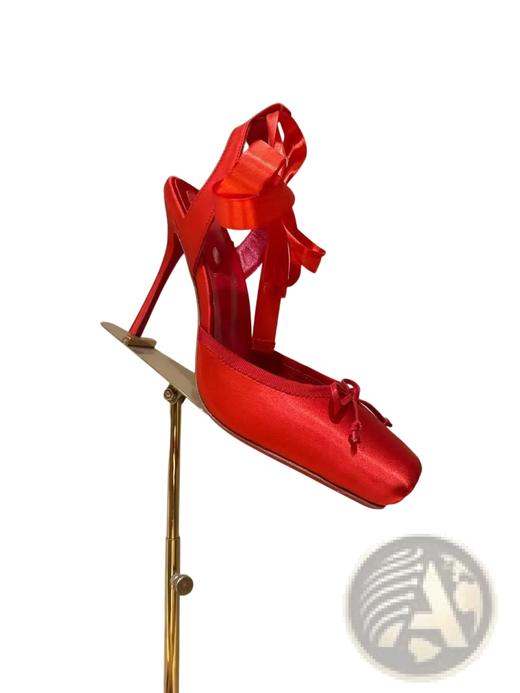 A vibrant red satin high heel ballet flat with leather sole and bow details on the ankle strap and toe