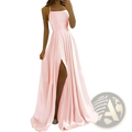 A flowing pink satin split maxi evening dress with thin spaghetti straps and a high slit for prom or formal events