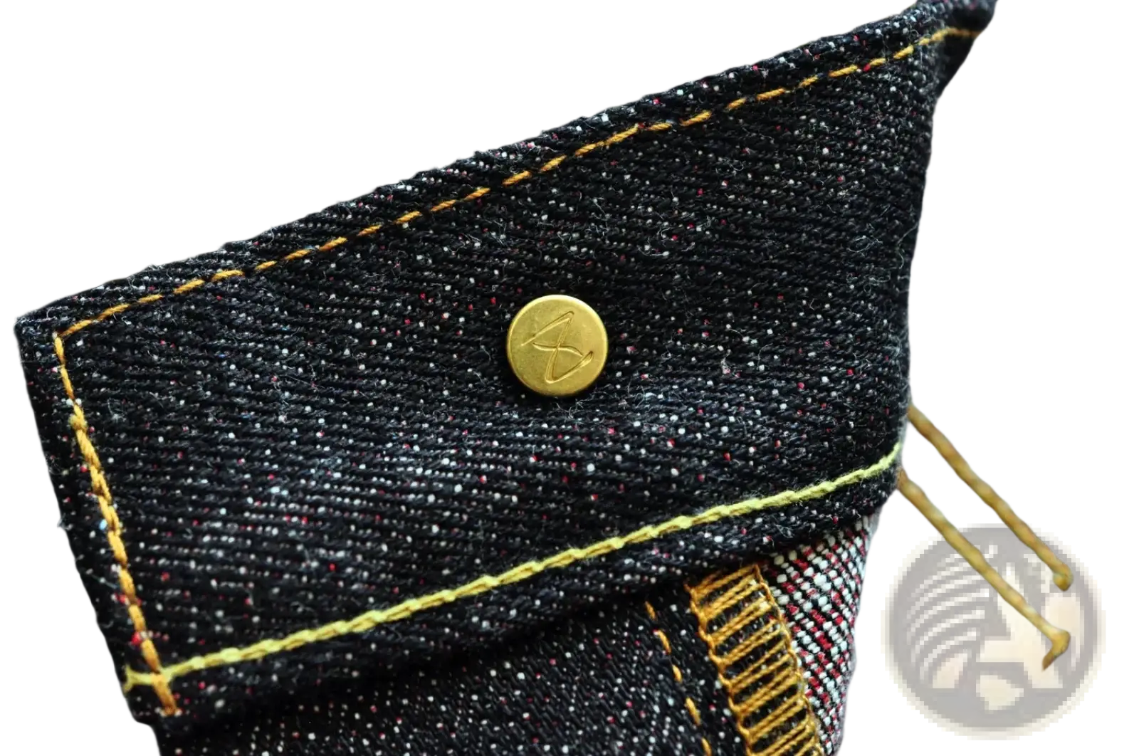 Dark indigo denim jacket with gold toned buttons and yellow stitching paired with saucezhan fire selvedge tapered jeans