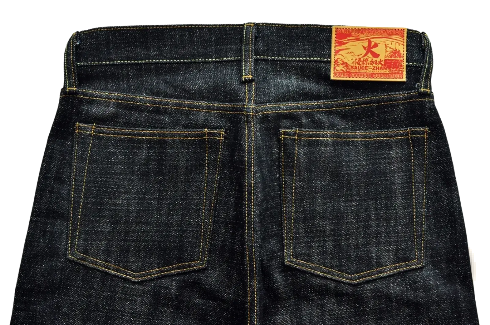 Back view of saucezhan fire selvedge tapered raw denim jeans in dark indigo with yellow stitching and red waistband label