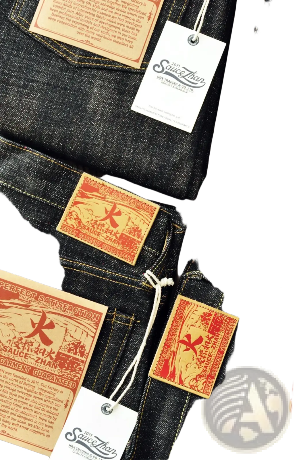 Dark indigo selvedge tapered raw denim jeans with orange and red fire character embroidery by Saucezhan