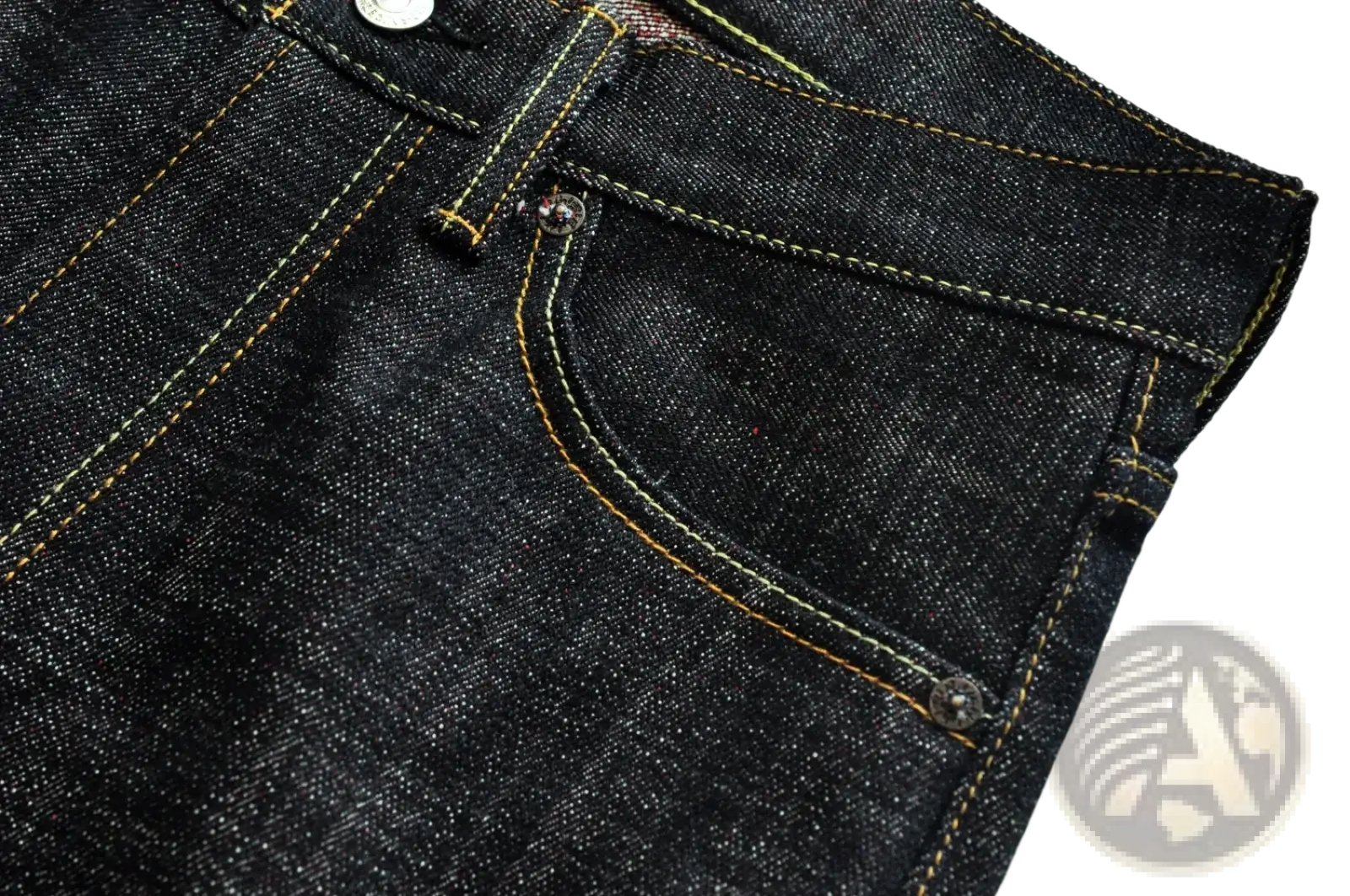 Dark indigo saucezhan fire selvedge tapered raw denim jeans with yellow stitching and silver metal buttons