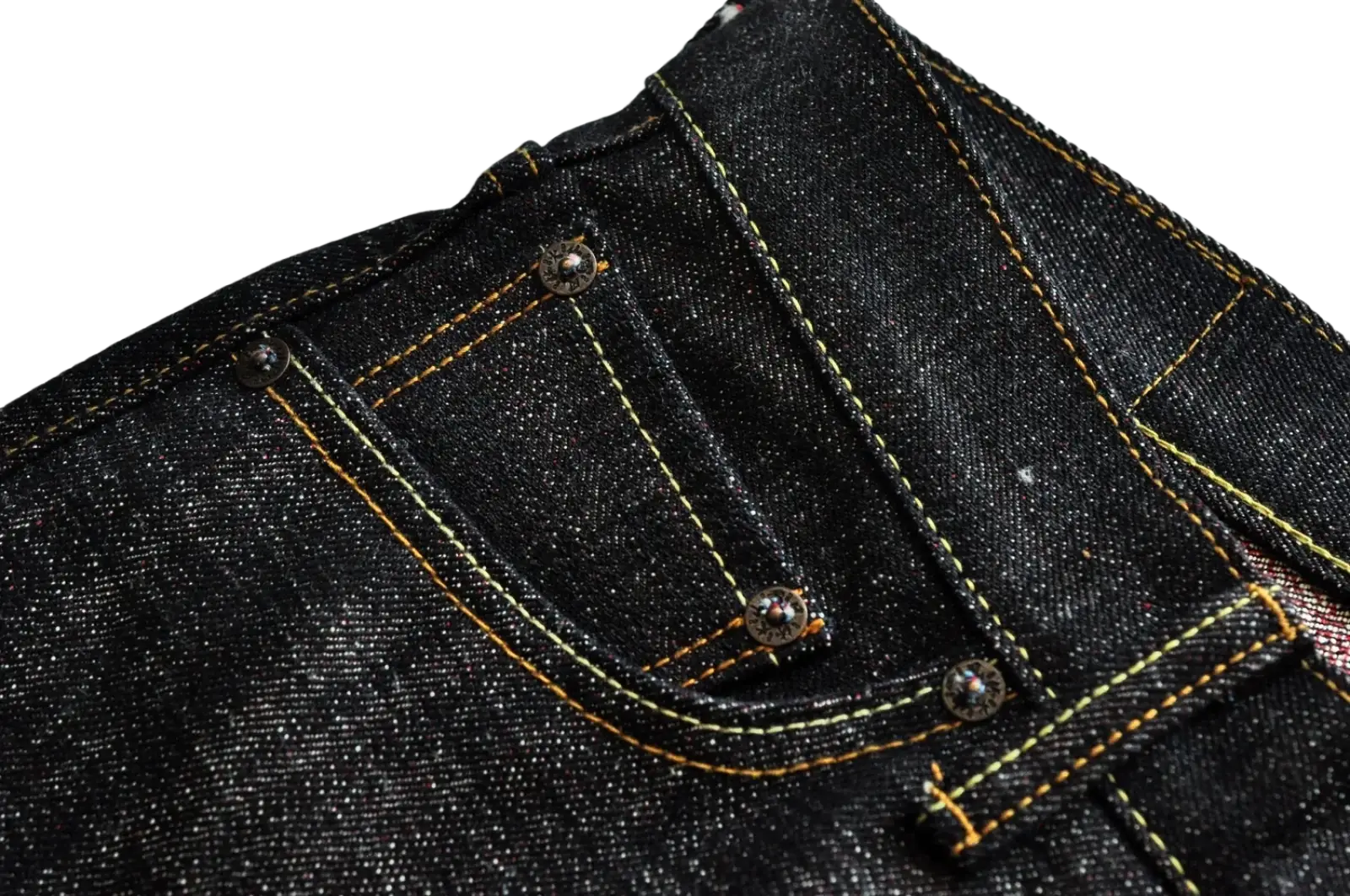 Sauceszhan fire selvedge tapered raw denim jeans in dark indigo with yellow stitching and silver metal rivets