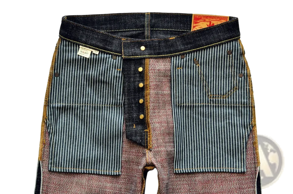 Dark-wash Saucezhan Fire Selvedge tapered raw denim jeans with patchwork pinstriped panels and brown stitching