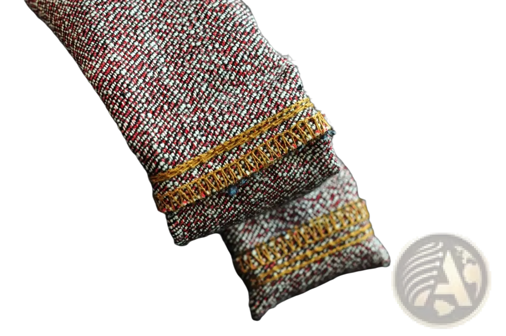 Maroon and white tweed fabric with gold stitching along the hem on saucezhan fire selvedge tapered raw denim jeans