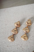 Gold layered scallop shell drop earrings featuring a gold-toned, three-piece layered design