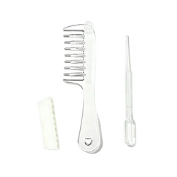 Clear plastic scalp massage applicator brush with metallic teeth heart cutout white case and essential oil dropper
