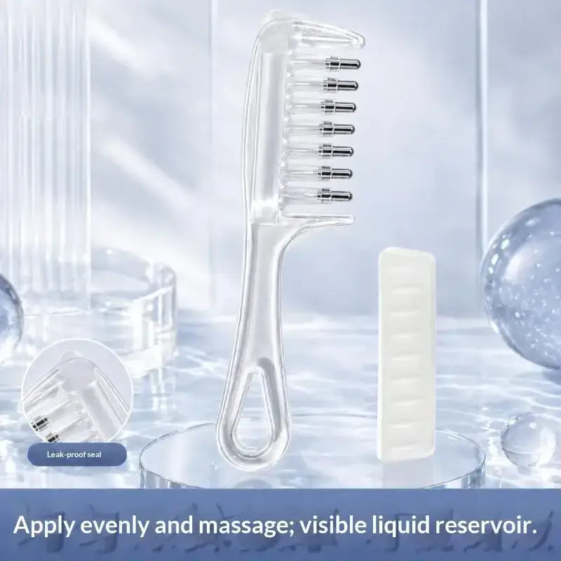 Clear plastic scalp massage applicator brush with metallic bristles and liquid reservoir for essential oil use