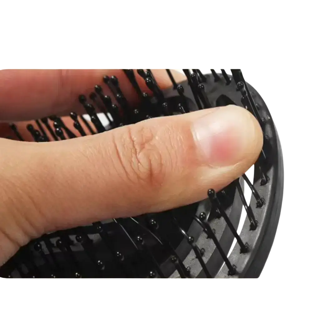 Black memory nylon scalp massage styling brush with rounded flexible bristles and curved vent hair tool design