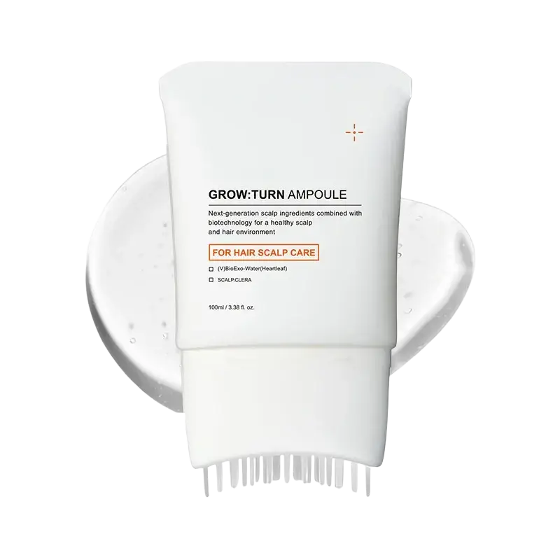 White tube of grow turn scalp treatment serum with built-in brush ampoule for targeted scalp care application