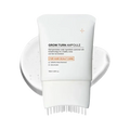 White tube of grow turn scalp treatment serum with built-in brush ampoule for targeted scalp care application