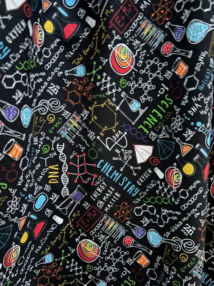Science print 1950s cotton midi dress with pockets featuring black fabric with colorful scientific symbols and terms
