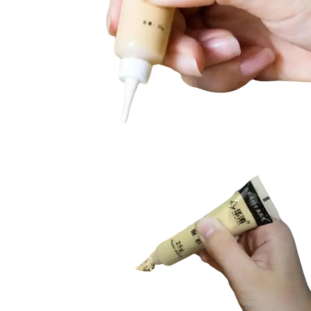Beige wood filler repair paste tube with white nozzle for touch-up paint and complementary paint in scratch repair kit