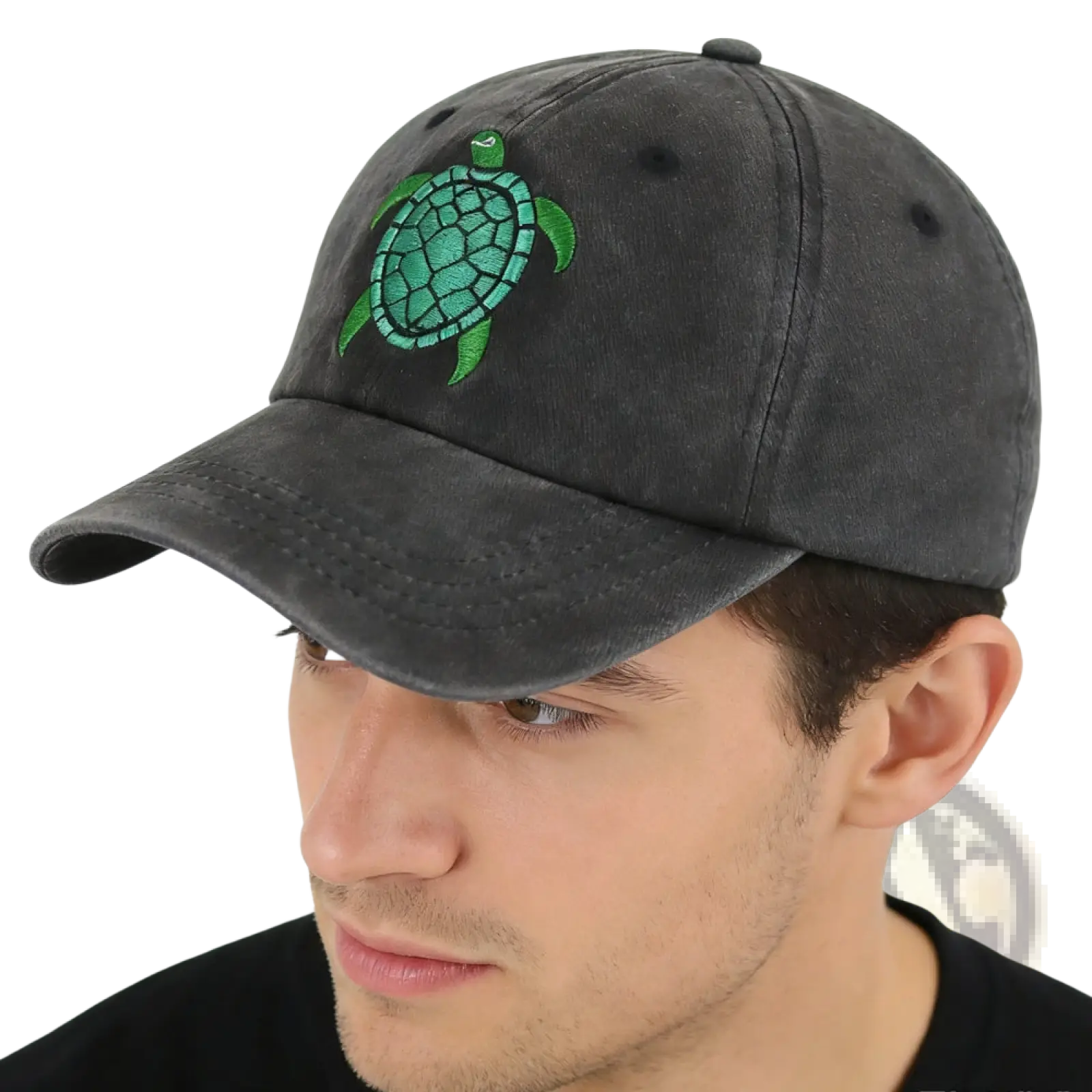 Dark gray distressed baseball cap featuring a vibrant green embroidered sea turtle on the front panel