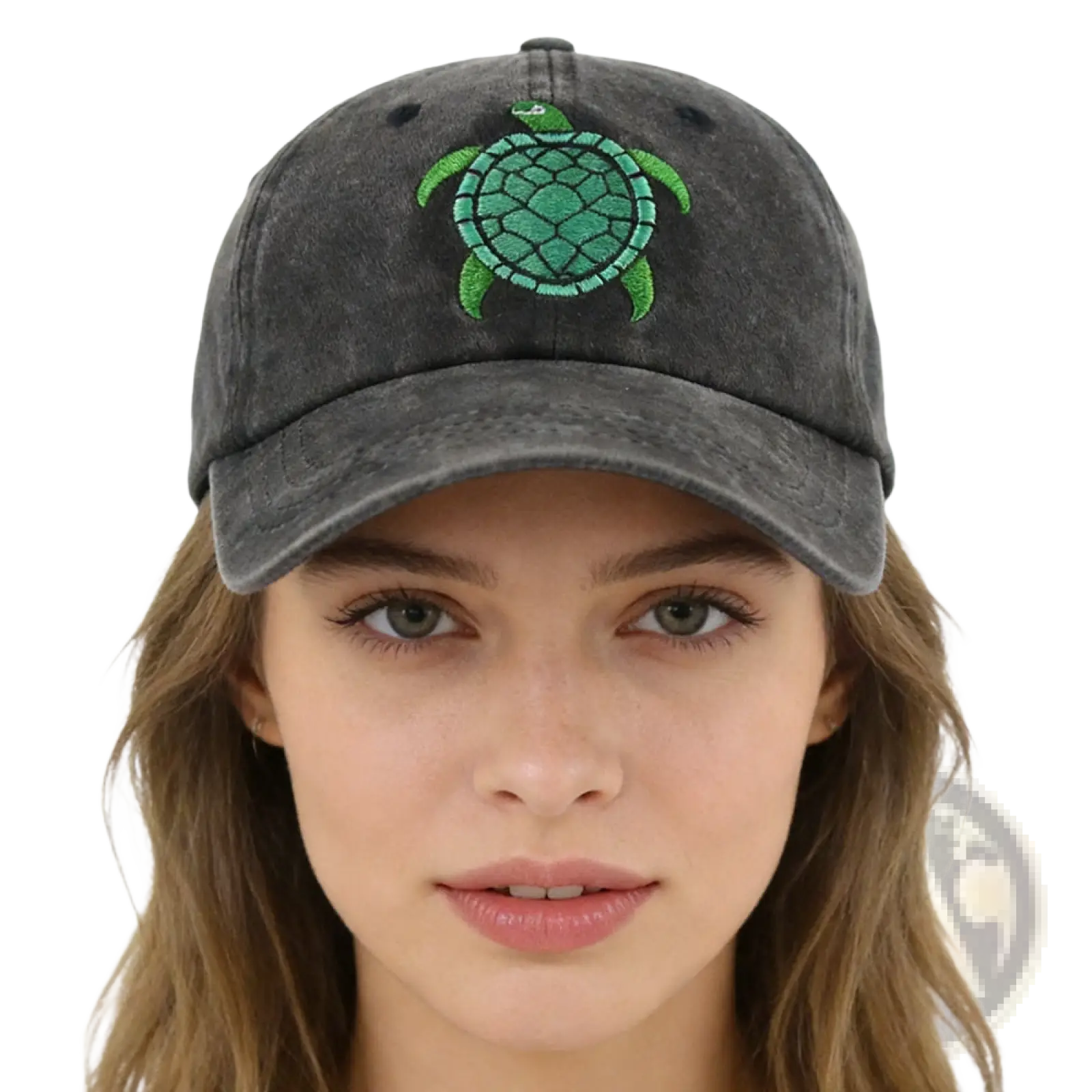 A dark gray distressed baseball cap with a vibrant green embroidered sea turtle design on the front